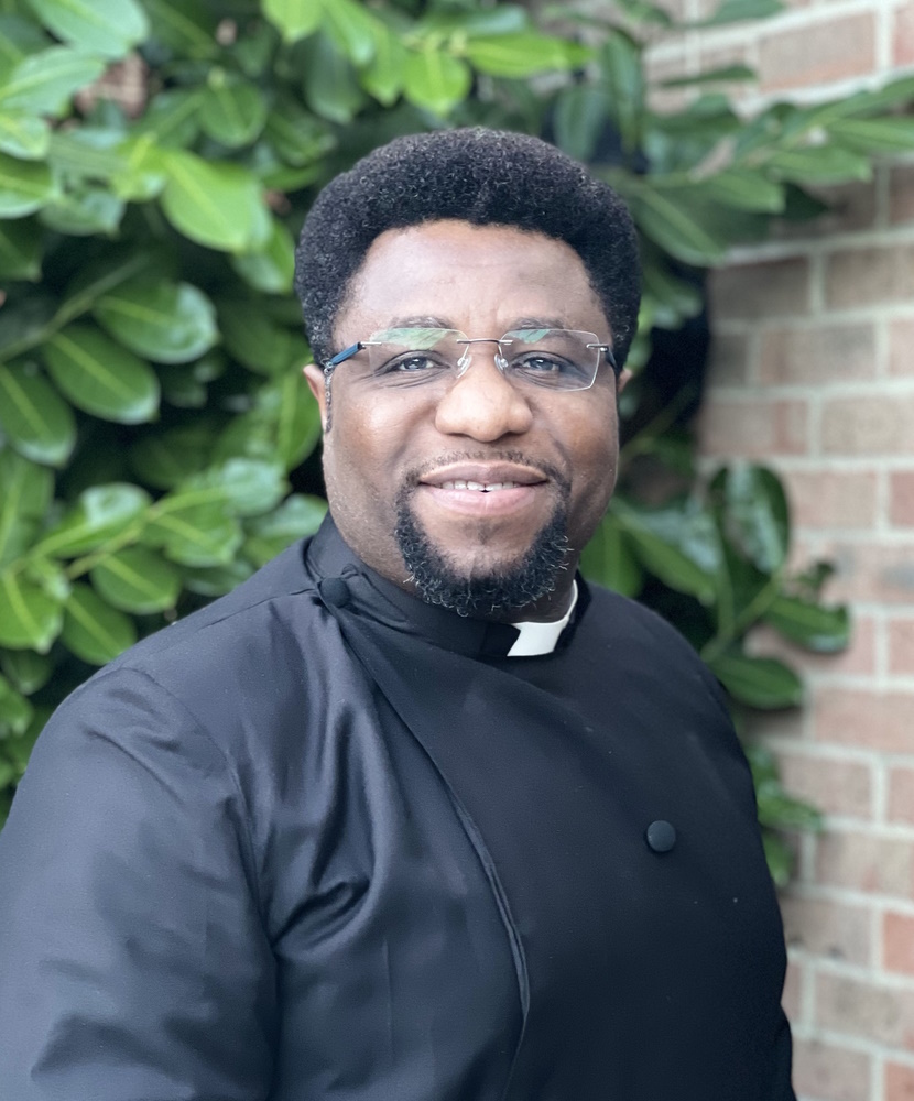 Fr. Andrew Appiah with a leafy background